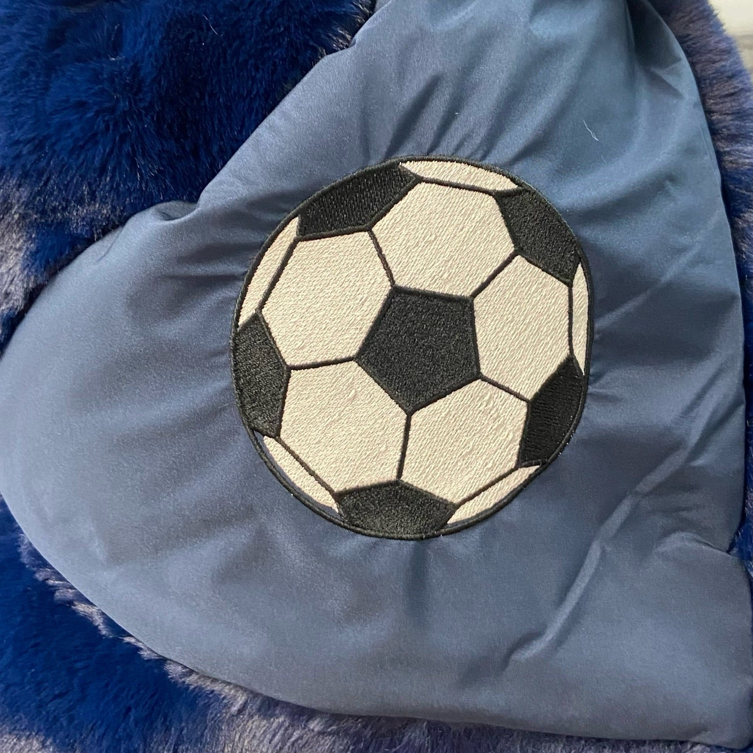 Soccer Ball on Blue Outdoor Blanket